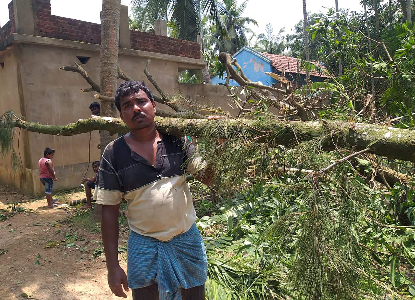 India struggles with twin challenges of cyclone and pandemic