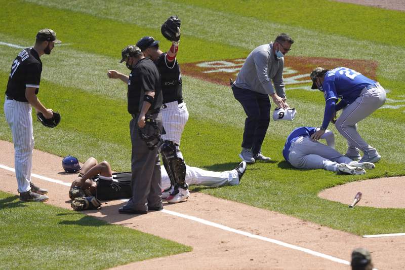 Abreu, Dozier collide, Royals and Chisox split doubleheader