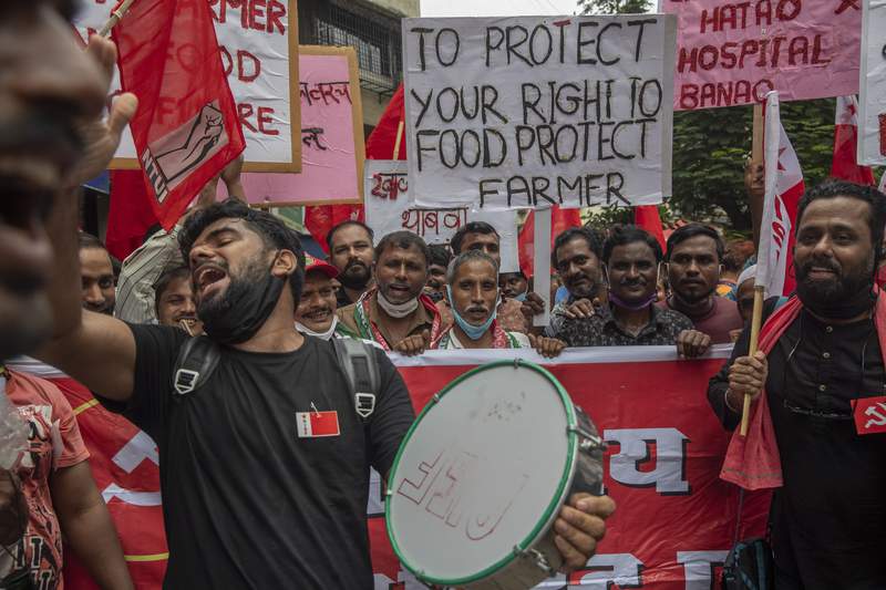 India's farmers renew protests, challenging Modi government