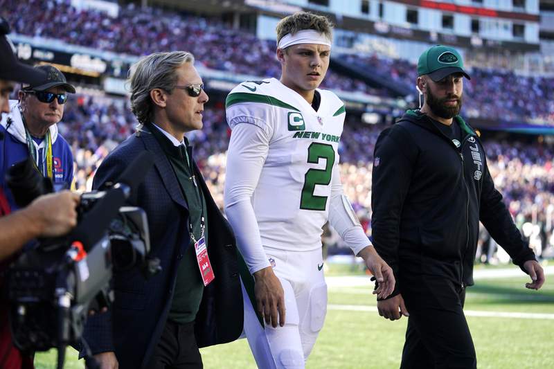 Wilson out 2-4 weeks with knee injury; Jets trade for Flacco