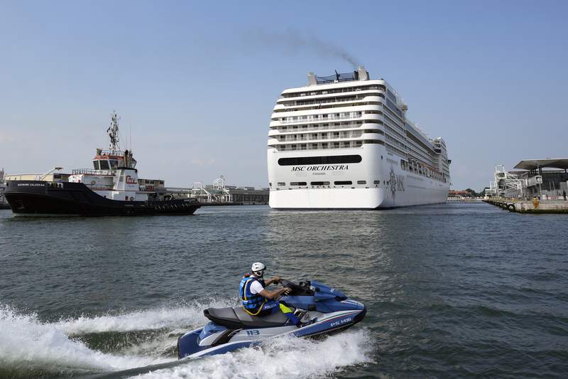 Cruise ships restart in Venice, bring environmental protests