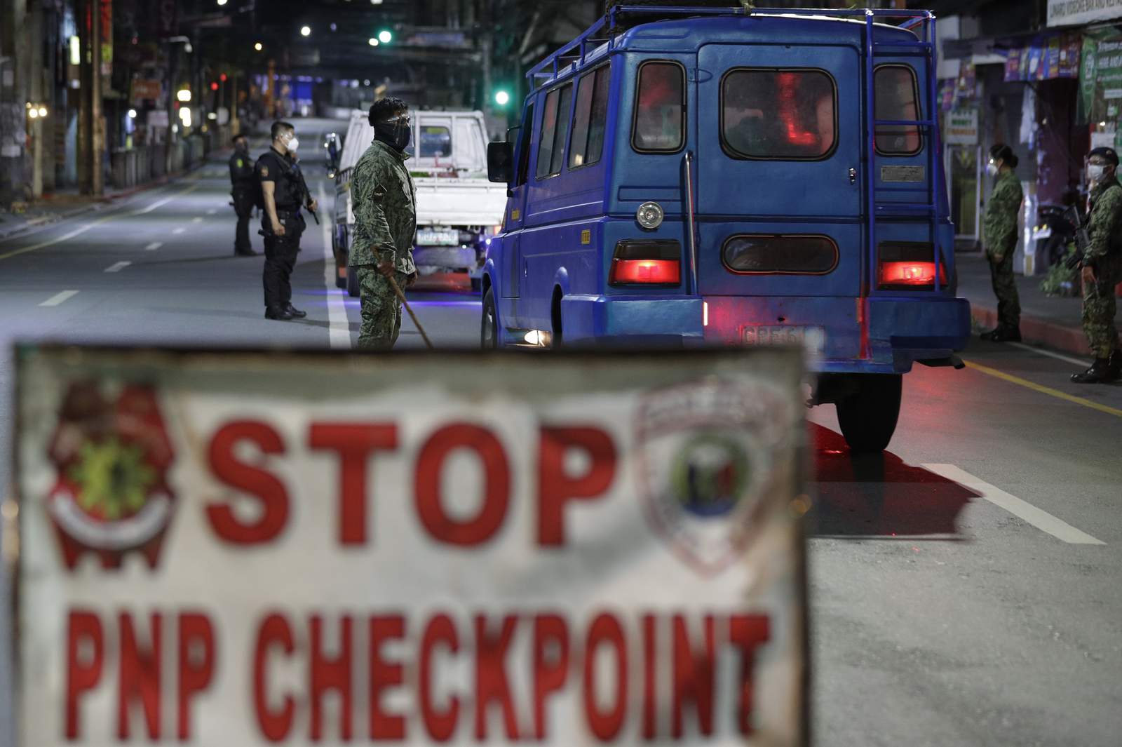 The Latest: Philippines imposes airport entry restrictions