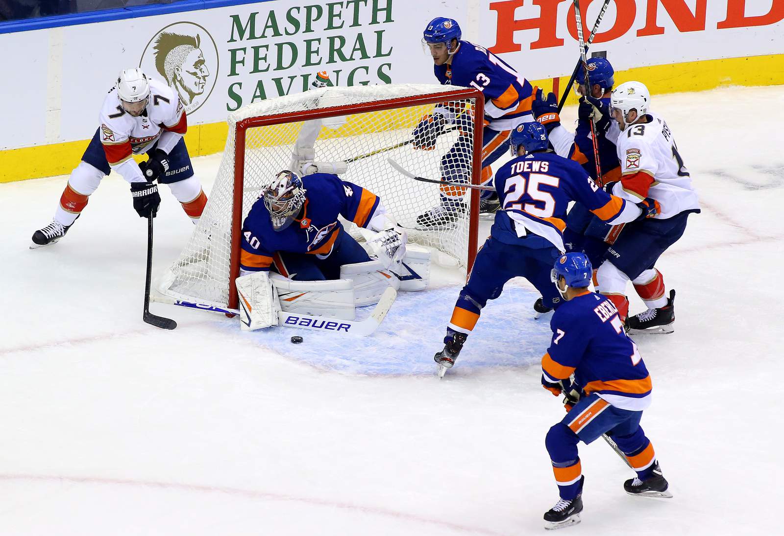 Varlamov stops 27 shots, Isles beat Panthers 2-1 in Game 1