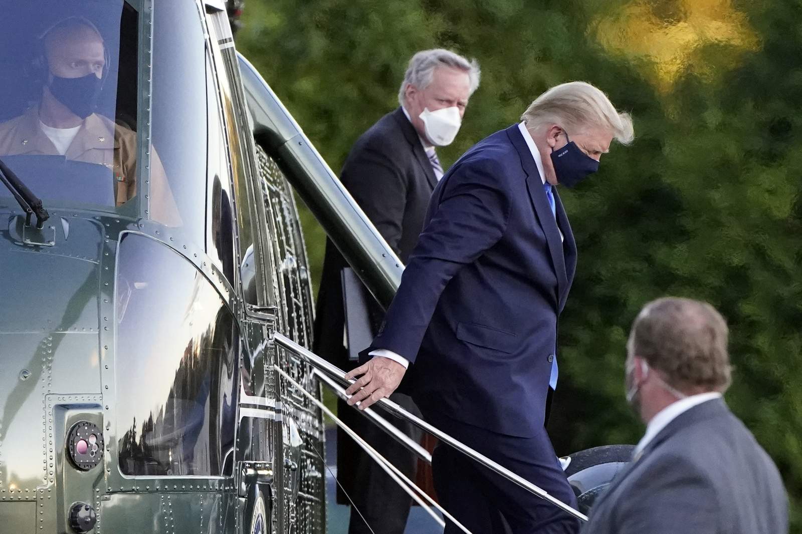 The Latest: Doctor says Trump 'not yet out of the woods'