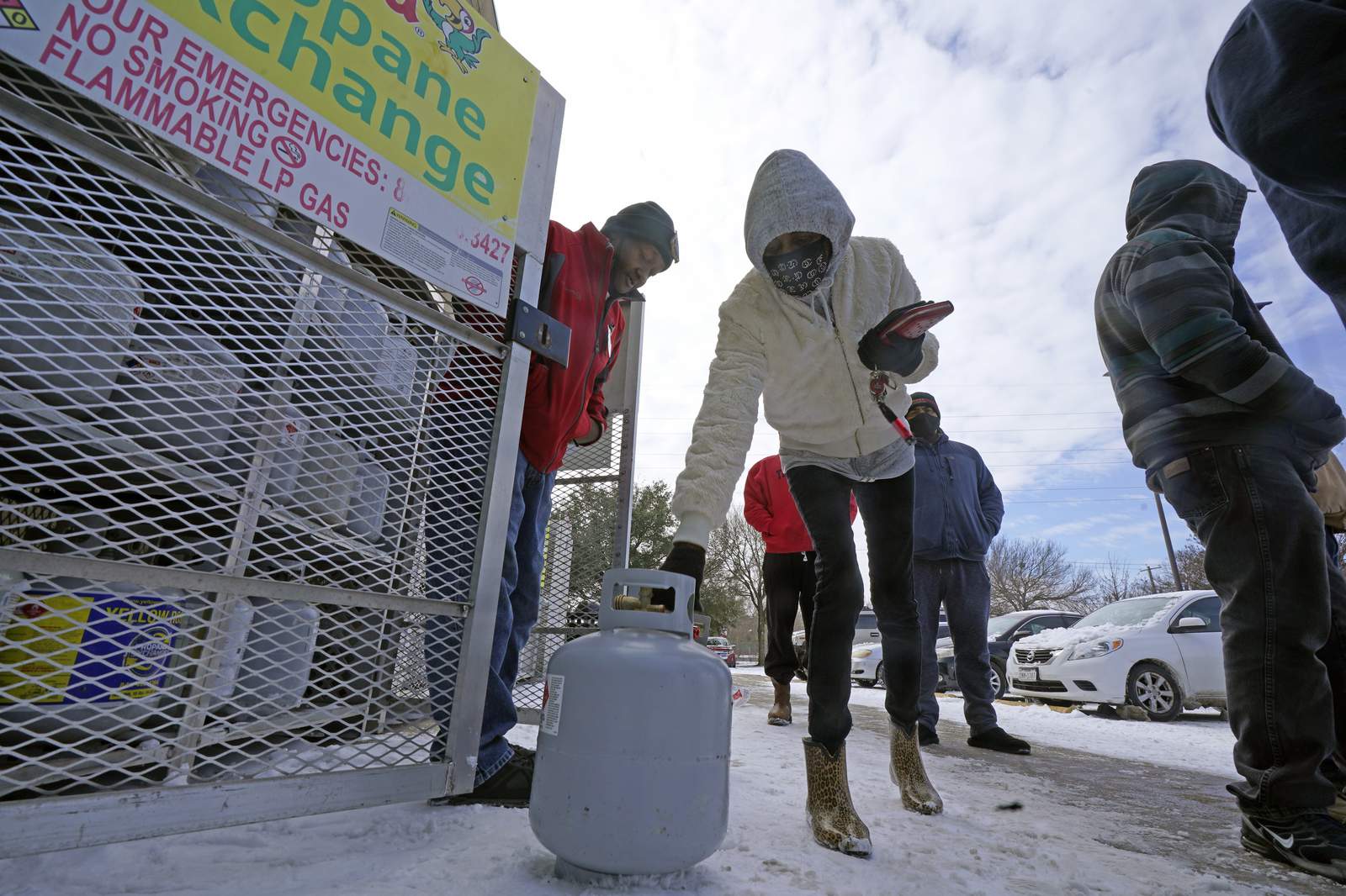 Millions endure record cold without power; at least 20 dead