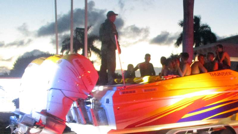 Deputy stops rental truck towing go-fast boat, finds 32 migrants hiding inside