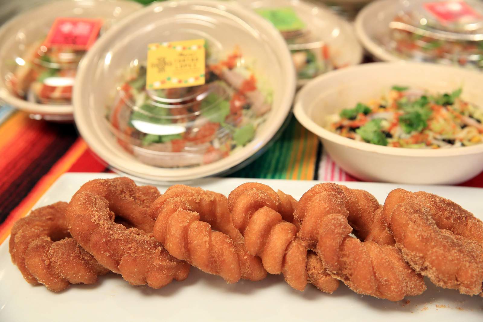 Mario's Tortas Lopez's cinnamon sugar-dusted churro doughnuts served with dulce de leche.