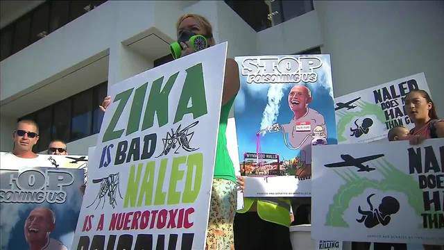 Protesters gather outside Miami Beach City Hall, want aerial mosquito spraying to end