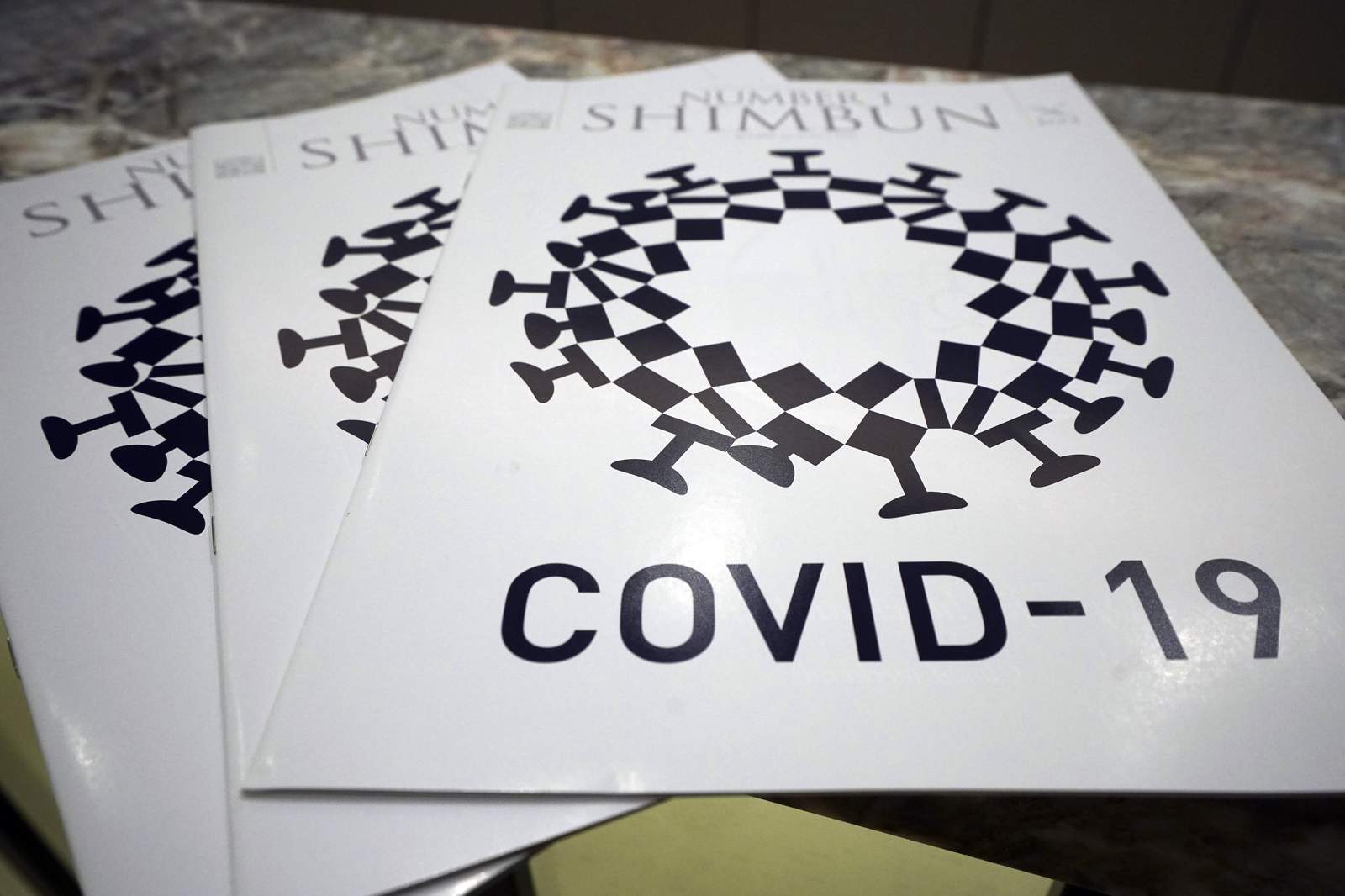 Tokyo Olympics protest parody of logo that depicts COVID-19
