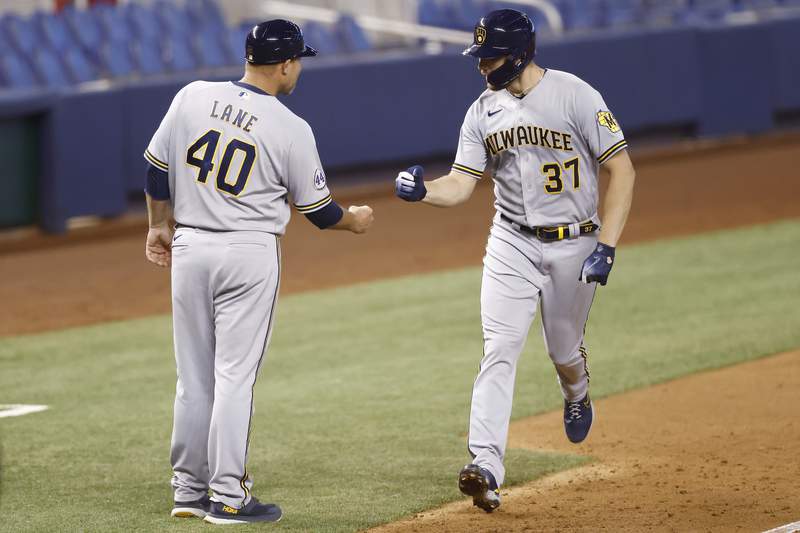 Houser homers, fans 10, Brewers stop 6-game skid, beat Miami