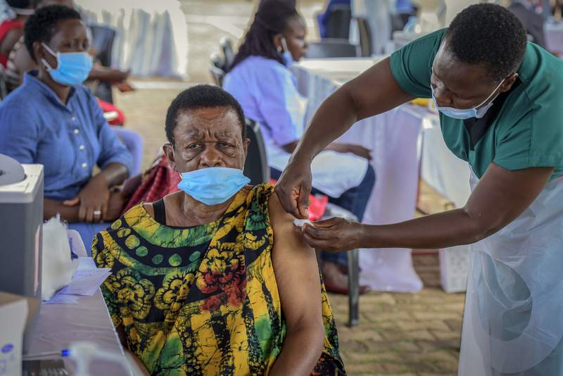 The Latest: Uganda tightening measures due to virus surge