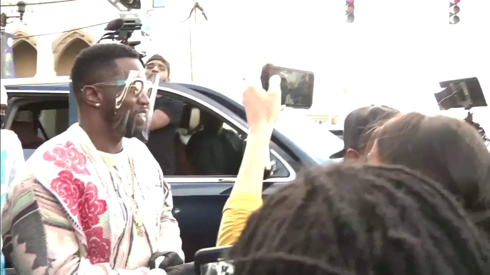 Sean ‘Diddy’ Combs helps distribute gift bags to Overtown residents in need
