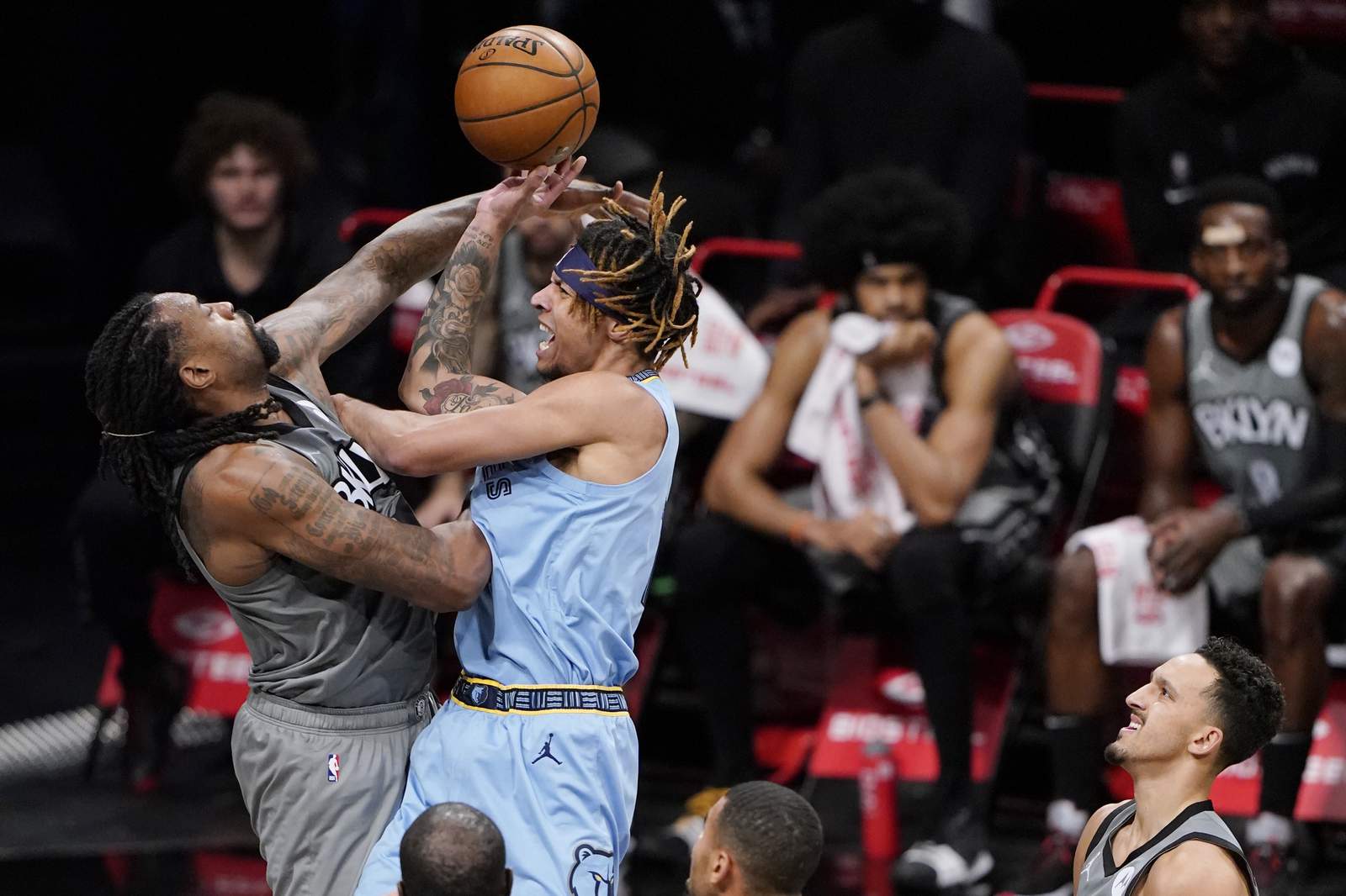 Grizzlies lose Morant to ankle injury, beat Nets in overtime