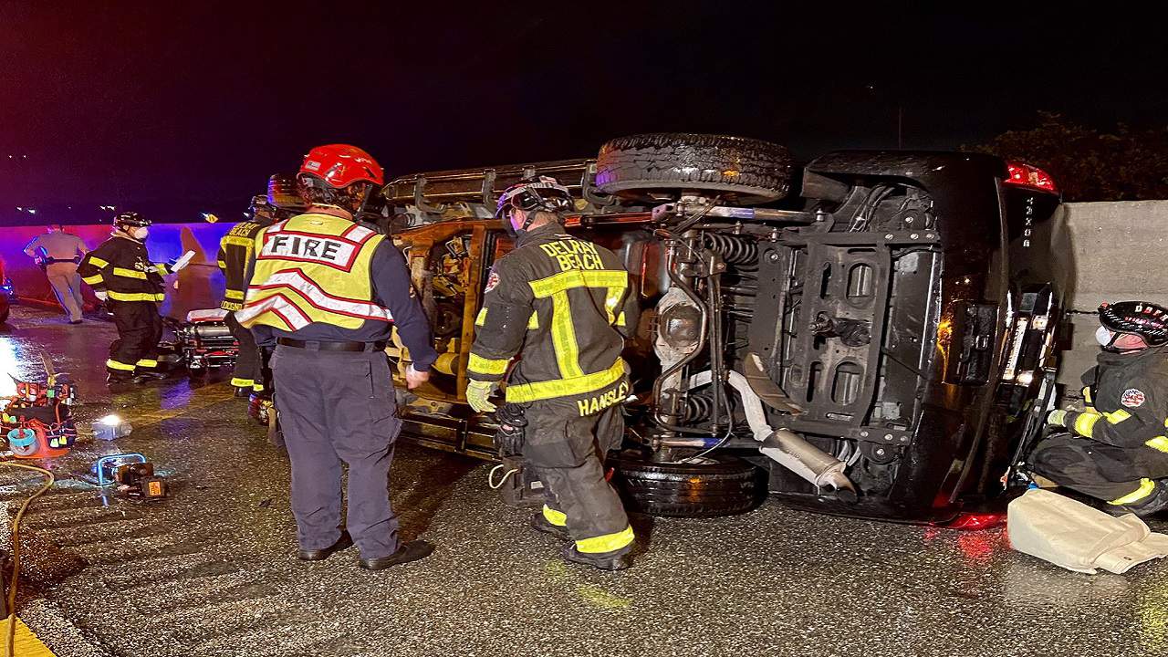 Adult, child extricated from SUV after it rolled over on I-95