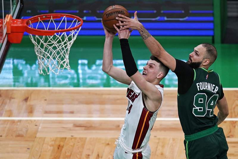 Heat clinch playoff spot with 129-121 victory over Celtics