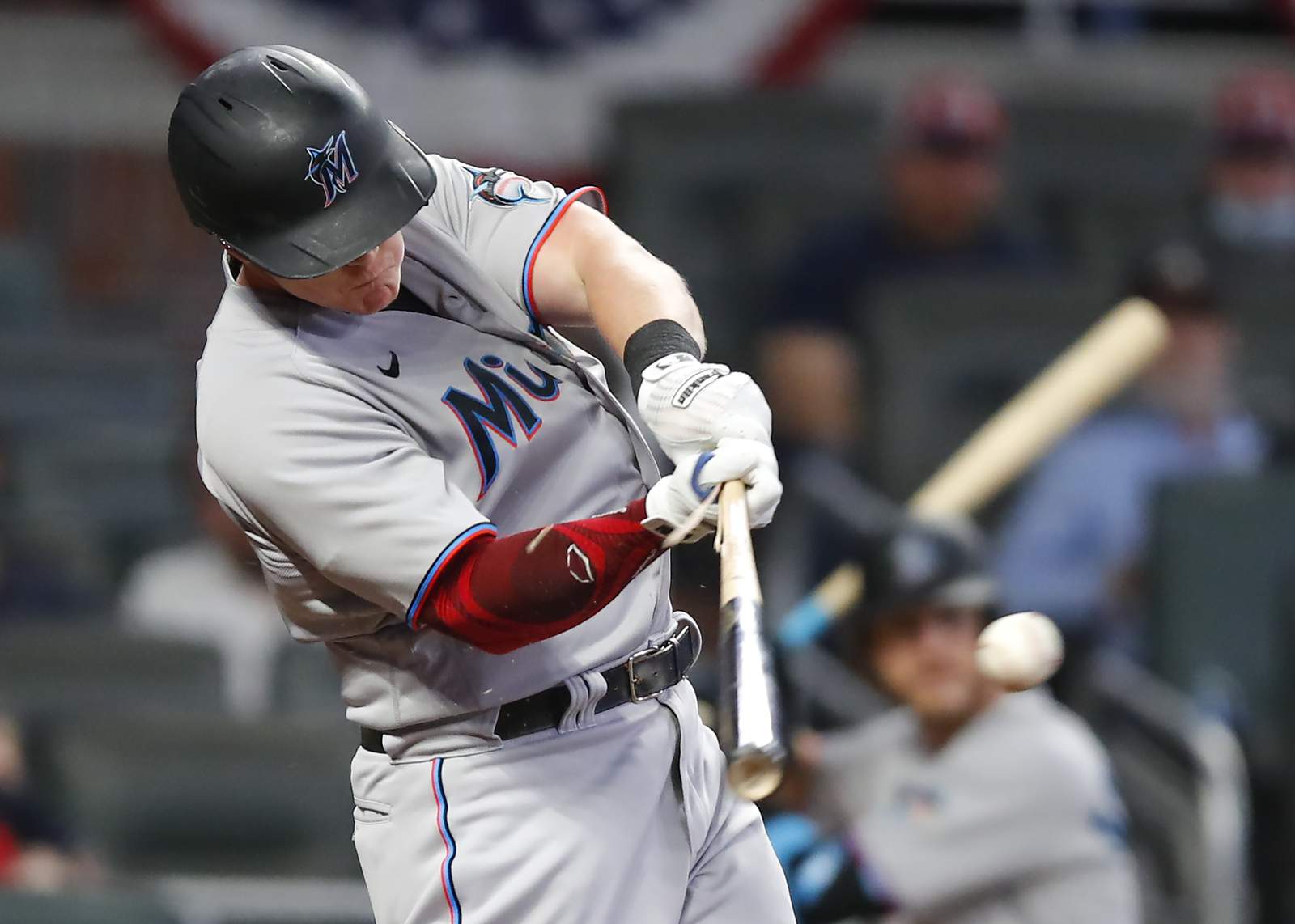 Cooper drives in 3 to lift Marlins over Braves in 10 innings