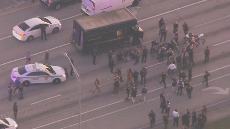 Police surrounds UPS truck after pursuit ends in gunfire