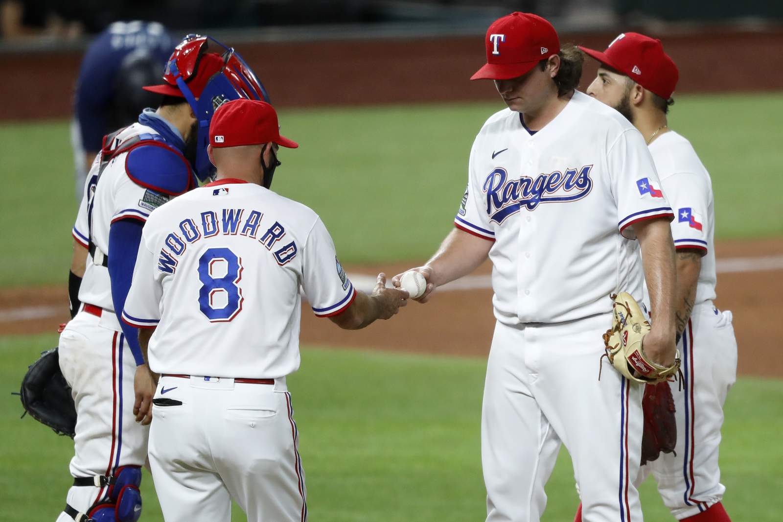 2 Rangers suspended for throwing behind hitter after slam