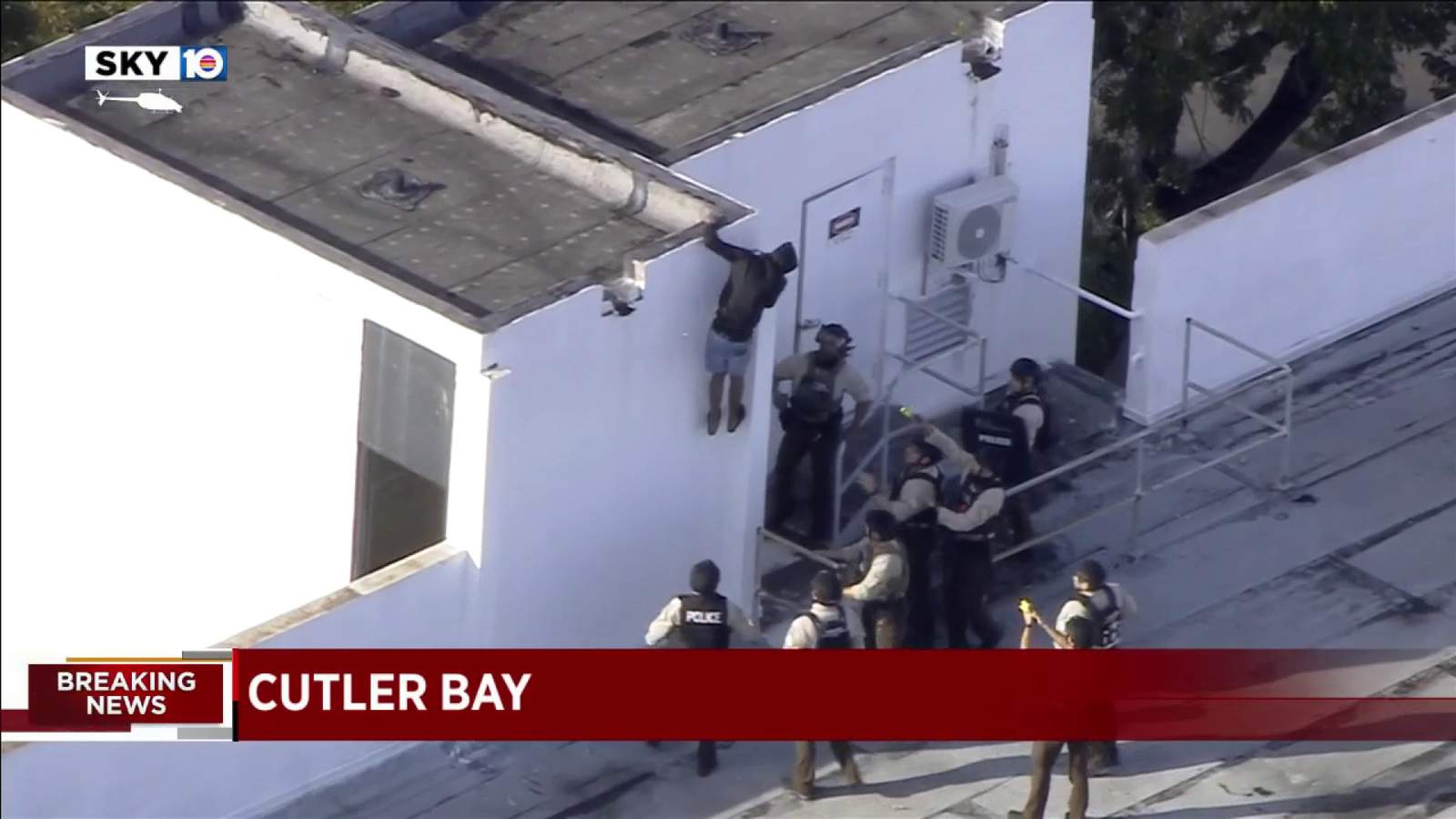 Officers surround Cutler Bay building after intruder stands on roof