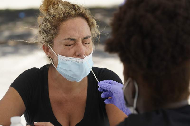 Florida virus cases soar, hospitals near last summer’s peak