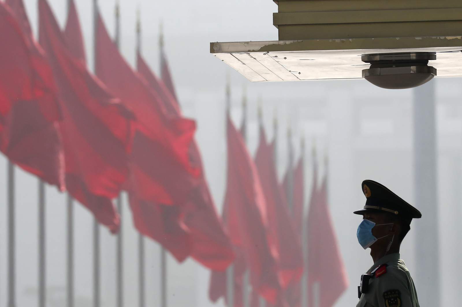 China boosts spending for virus-hit economy, takes up HK law