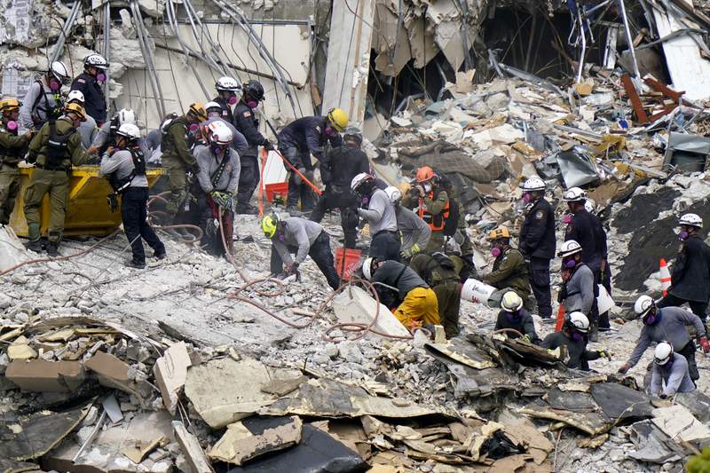 Crews from the United States and Israel work in the rubble Champlain Towers South residential condo, Tuesday, June 29, 2021, in Surfside, Fla. Many people were still unaccounted for after Thursday's fatal collapse. (AP Photo/Lynne Sladky)