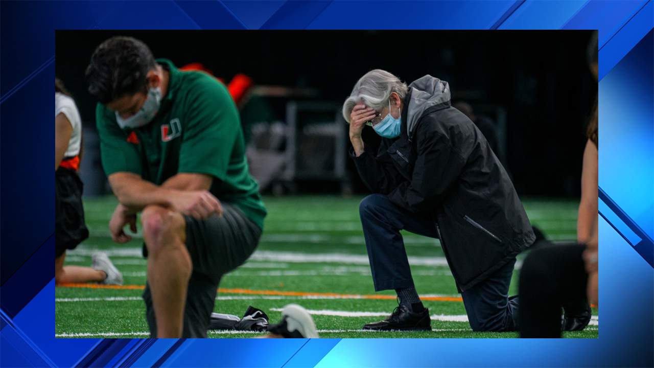 University of Miami president joins group of student athletes and their coaches for silent protest