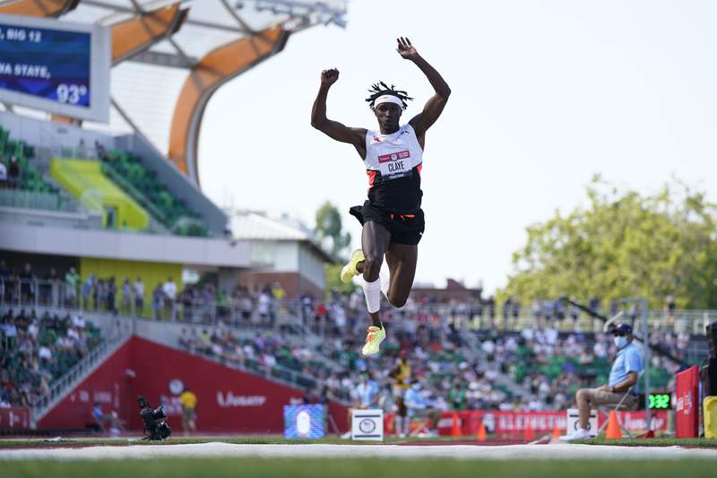 The Latest: Claye edges Scott to take triple jump crown