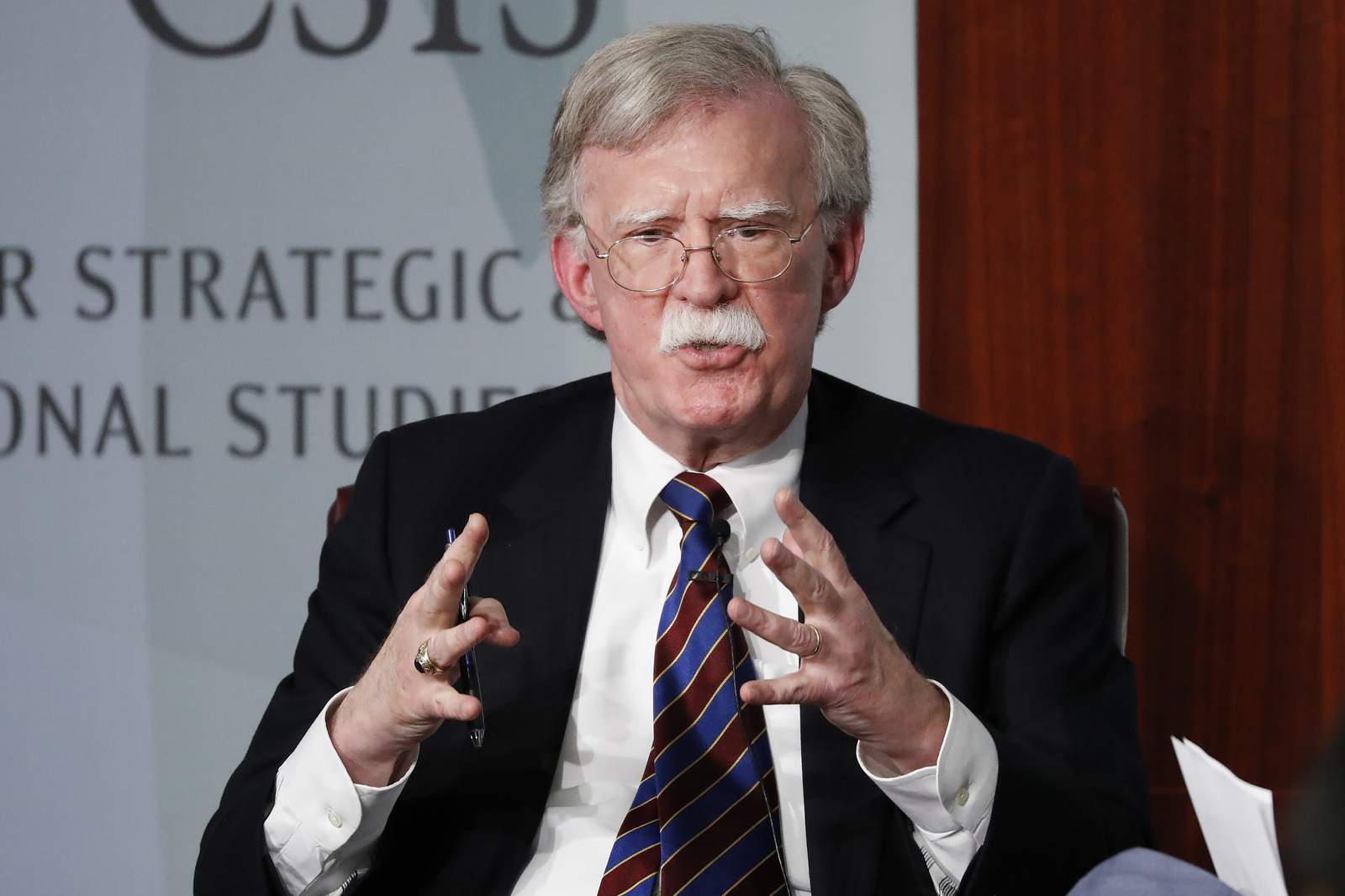 Judge says government's suit over Bolton book can proceed