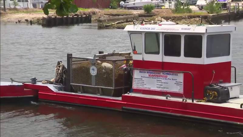 Restaurant hires barge to clean Miami River