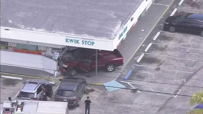 Pickup and car collide, then truck crashes into front of convenience store