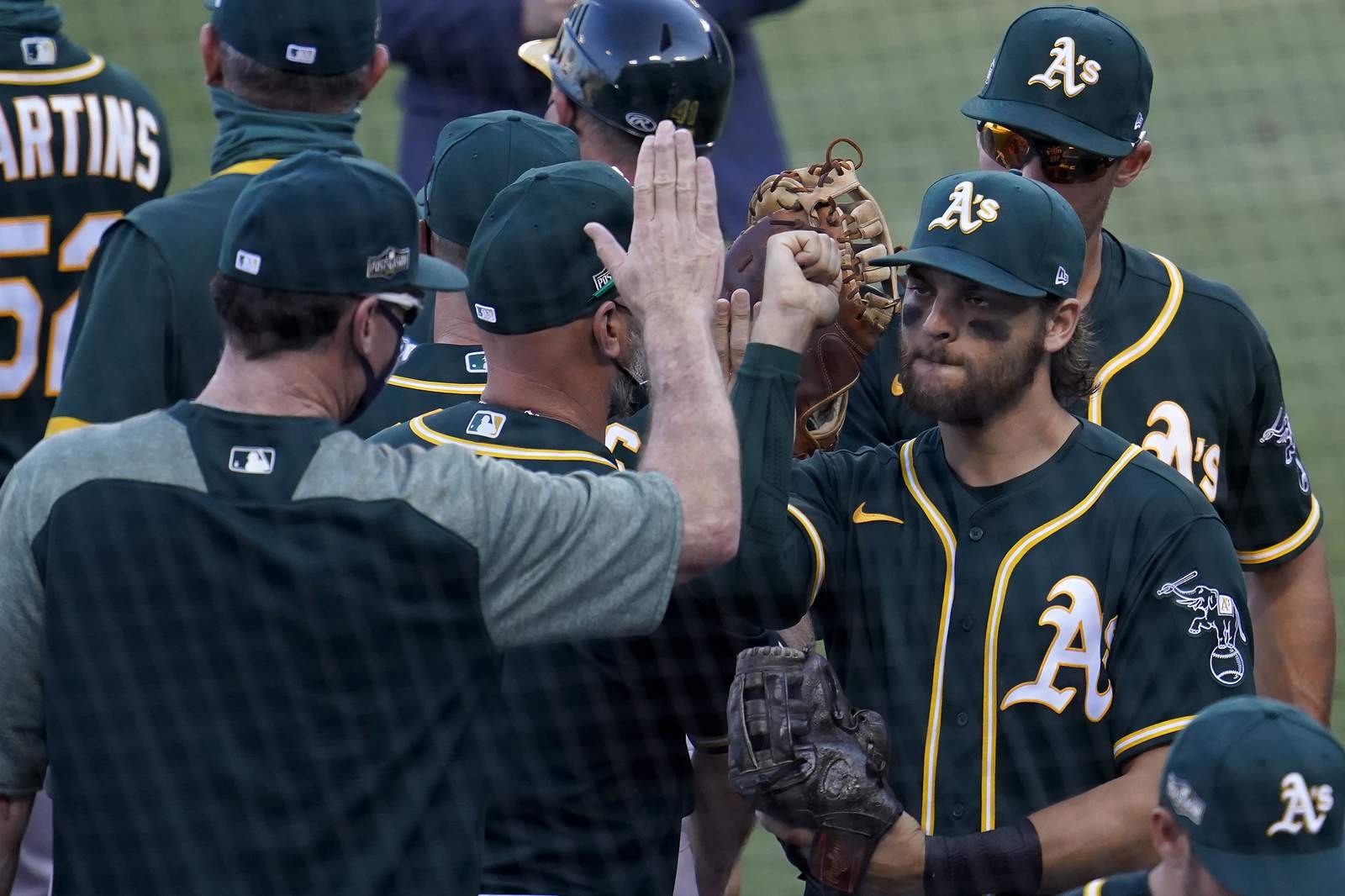 Pinder's HR helps rally A's past Astros 9-7, trail ALDS 2-1