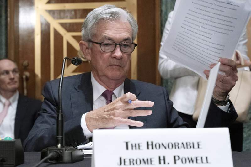 Under pressure, Powell says Fed to revamp its trading rules
