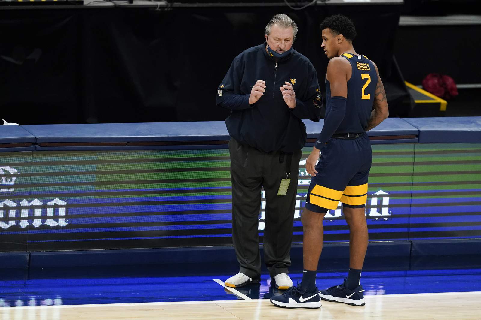 The Latest: Michigan State-Virginia hoops postponed