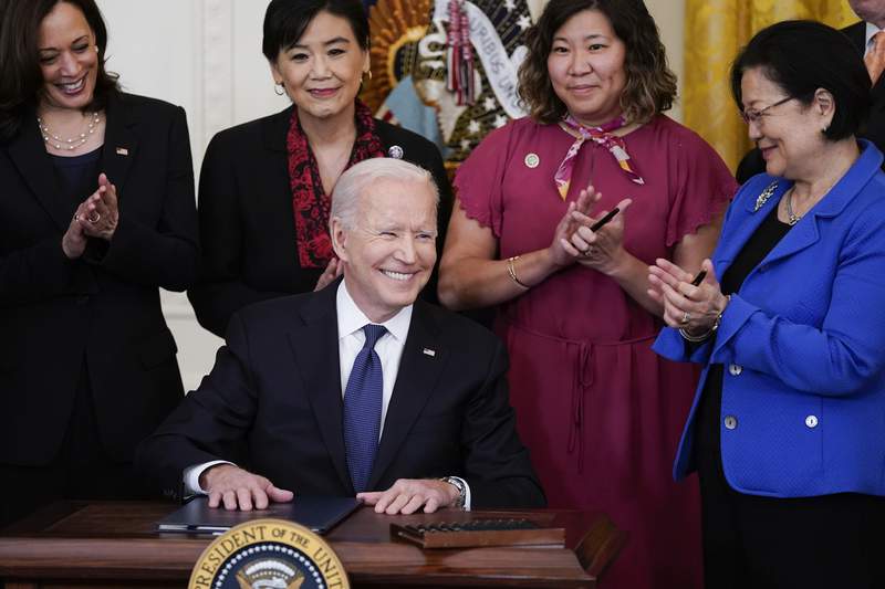 Biden signs bill to counter spike in anti-Asian hate crime