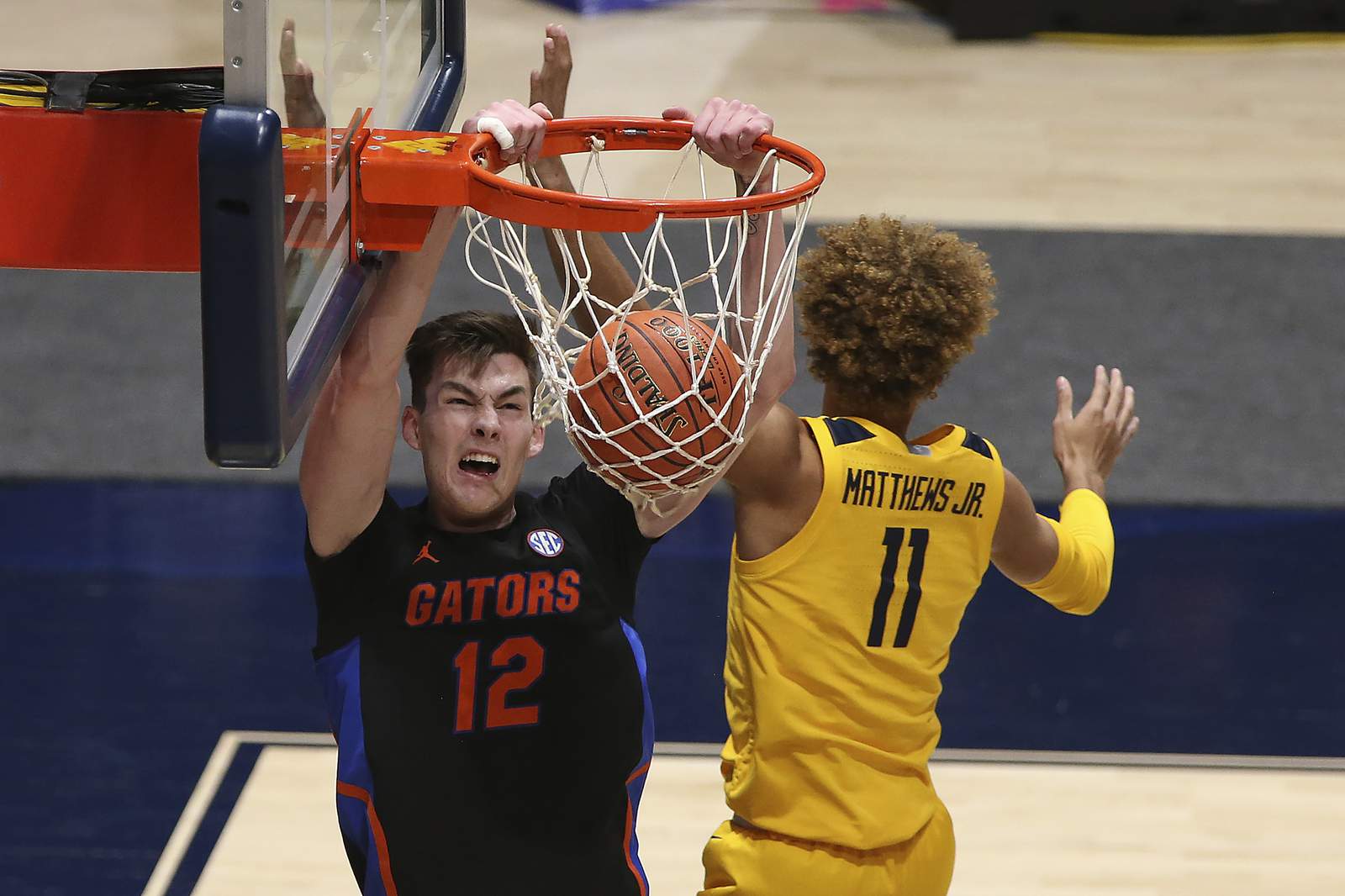 Florida beats No. 11 WVU in Big 12-SEC Challenge 85-80