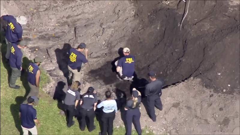 FBI uses excavator to dig for evidence in Oakland Park
