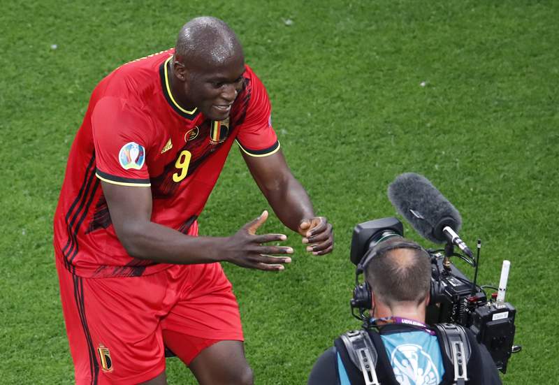 The Latest: Lukaku delivers message to Eriksen at Euro 2020