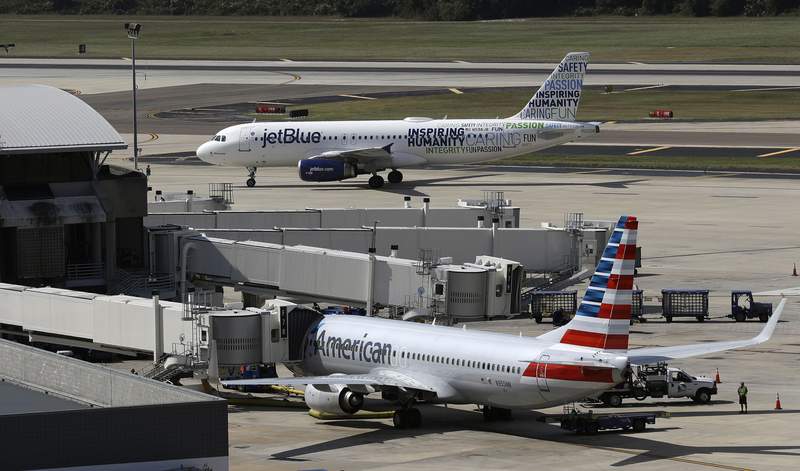 US sues to stop deal between American Airlines and JetBlue