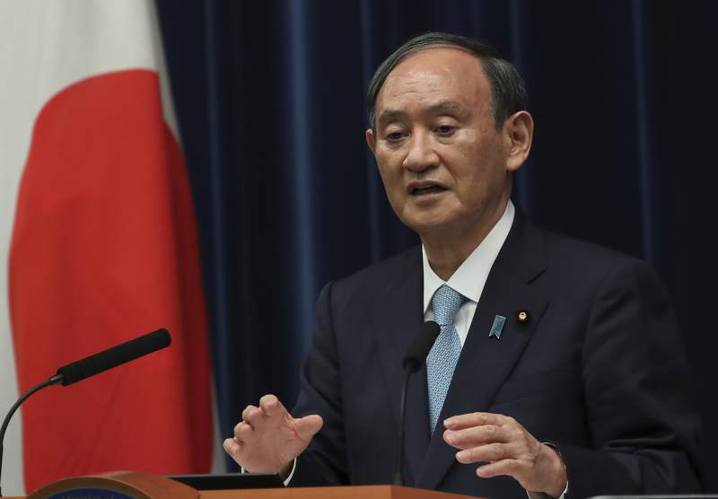 Japan extends virus emergency until end of September