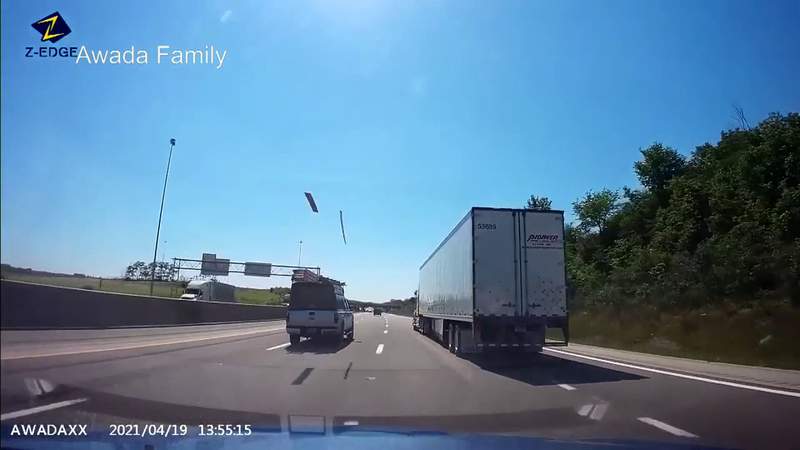Terrifying moments captured on camera as planks of wood fly into a windshield