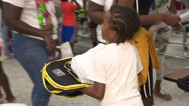 Police officers host back-to-school party for Liberty City students