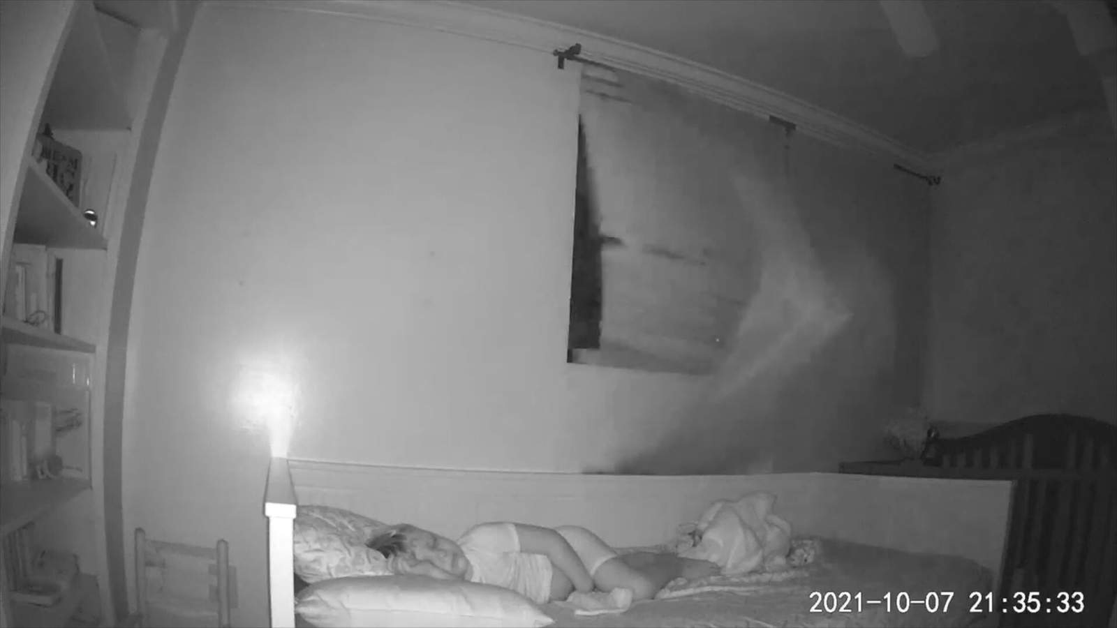 Baby monitor captures the moment a brick comes through the window of a child's bedroom in Miami Beach.