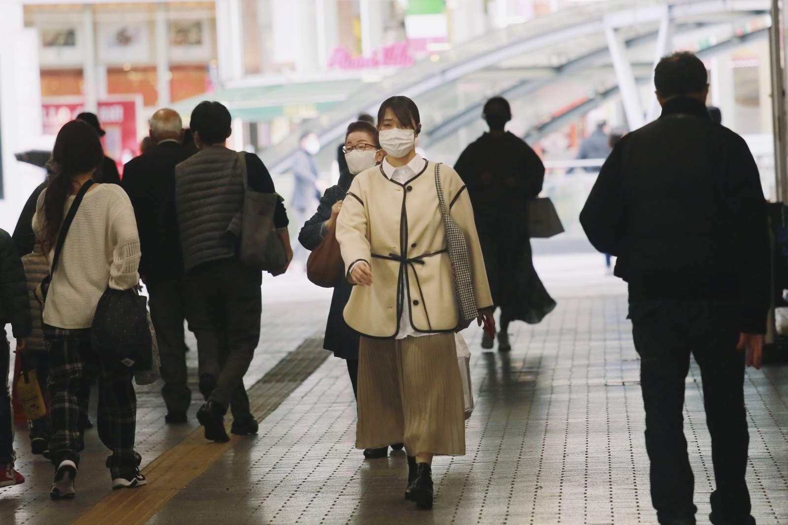 The Latest: Tokyo records single-day high in virus cases