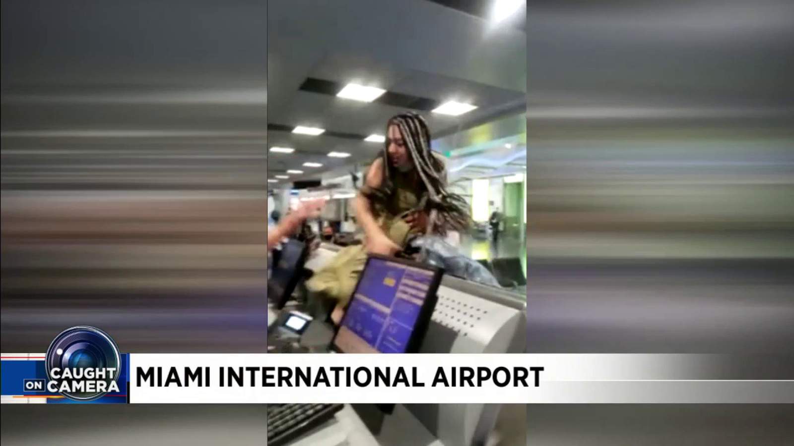 Video shows woman jump over ticket counter during meltdown at Miami International Airport