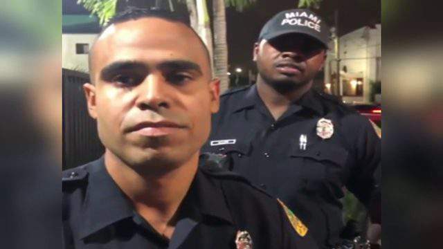 Miami police officer caught on camera smacking cellphone from man's hand