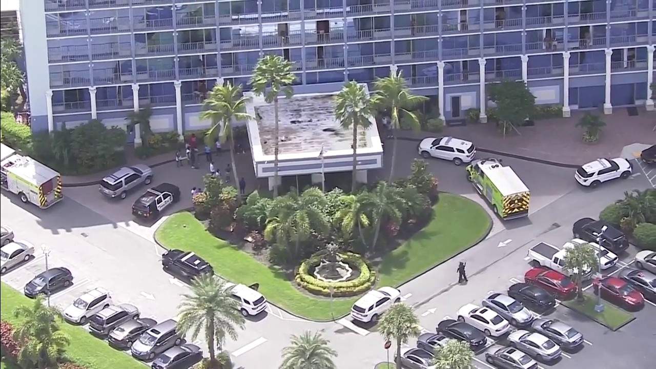 First responders arrive at the Stadium Hotel in Miami Gardens following a triple shooting.