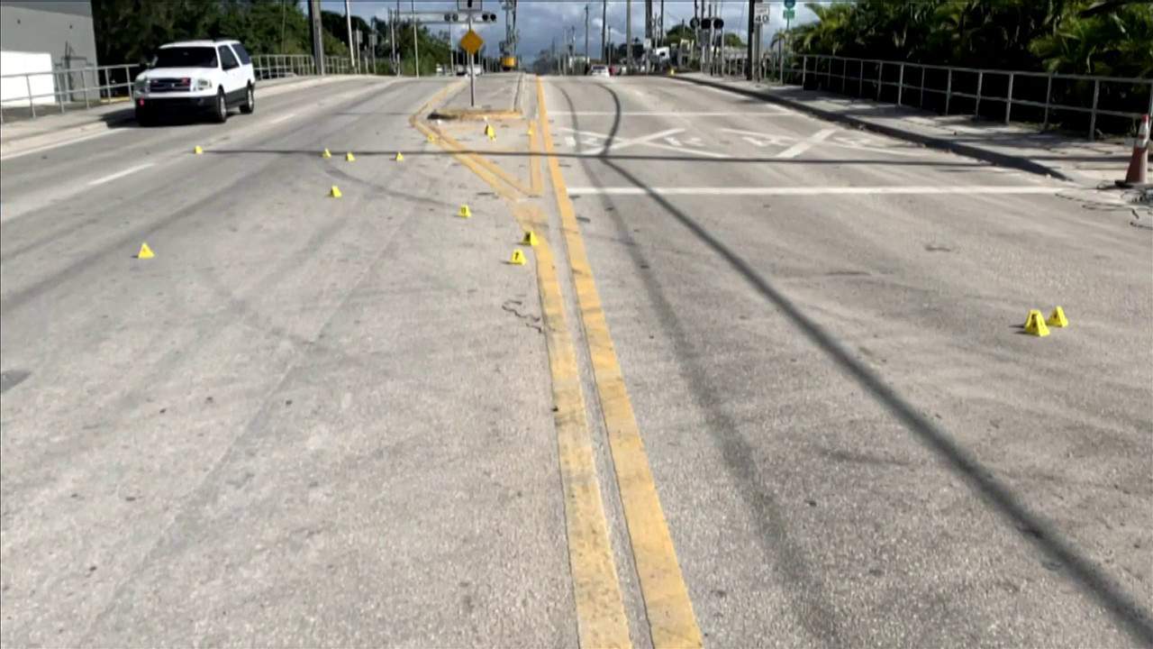 Police said around 20 shell casings were on the street after a driver opened fire on another vehicle in Opa-locka.