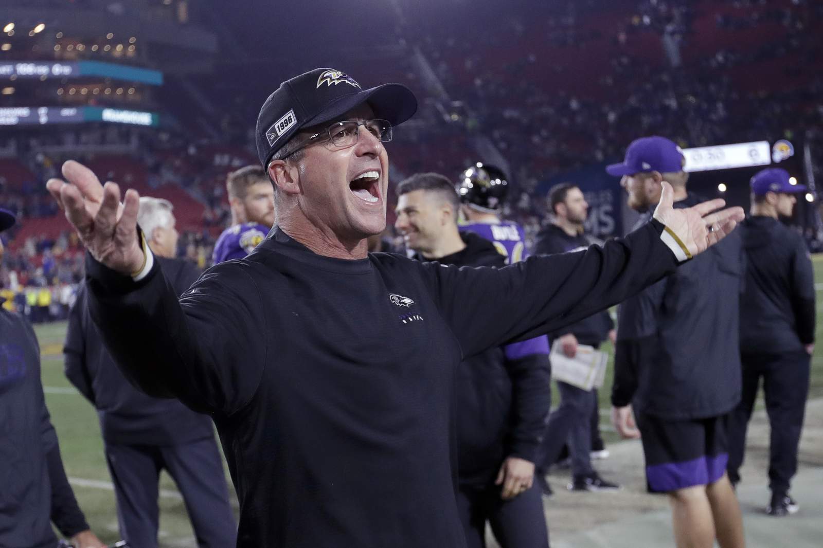 Harbaugh, Ravens happily travel road to success in playoffs