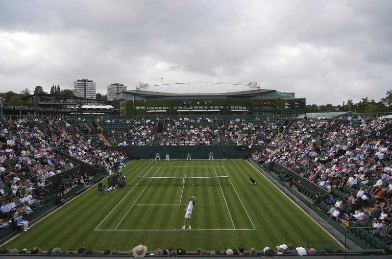 The Latest: Darkness at Wimbledon halts 11 matches